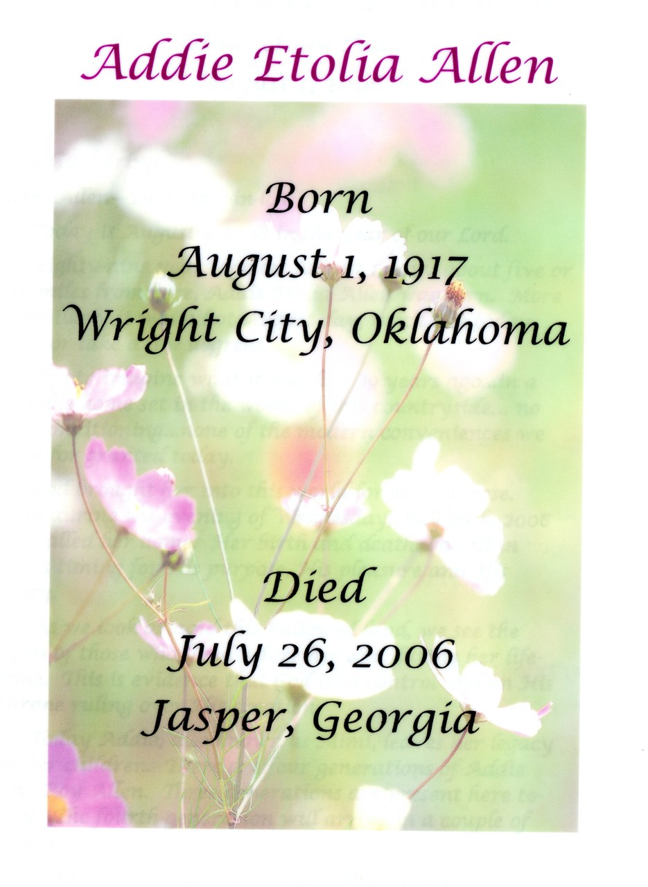 Memorial card with delicate flowers and biographical text overlay.